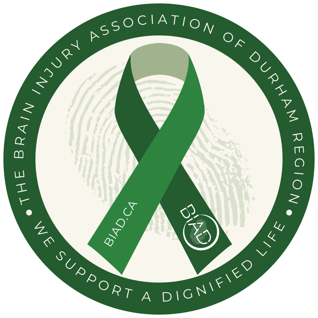 Round Button with a green ribbon that has the word Brain Injury Association of Durham Region 