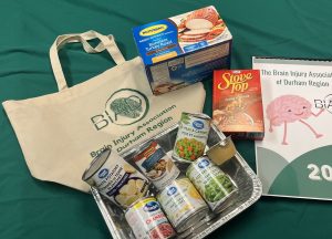 Bag with green BIAD logo and and food. Small calendar with a brain cartoon. 
